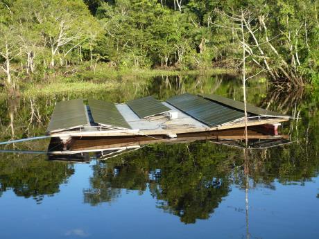 Amorphous photovoltaic solar panels floating in the Sani Lodge lagoon